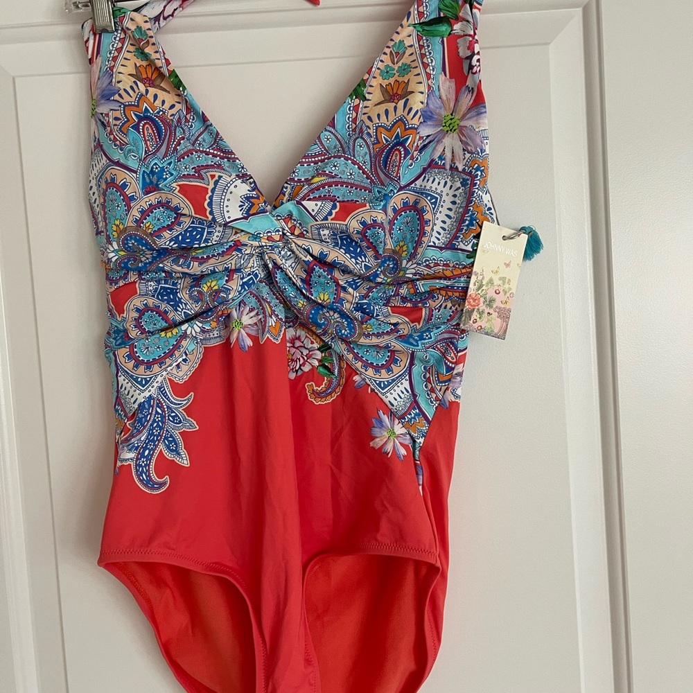 New with tags, one piece. Halter style bathing suit.